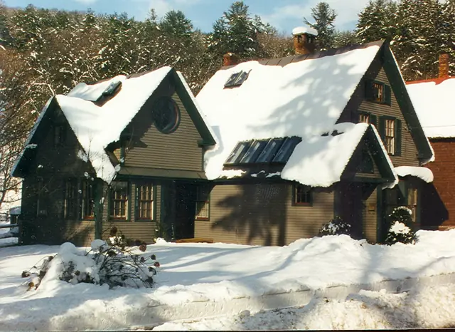 Multi-gabled home under fresh snow
