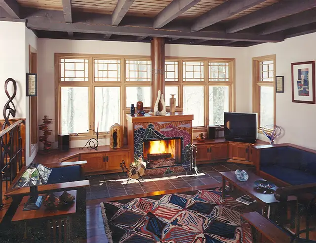 Living room with brick fireplace and exposed beams