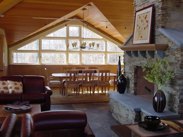 Vaulted great room with a wall of arched windows