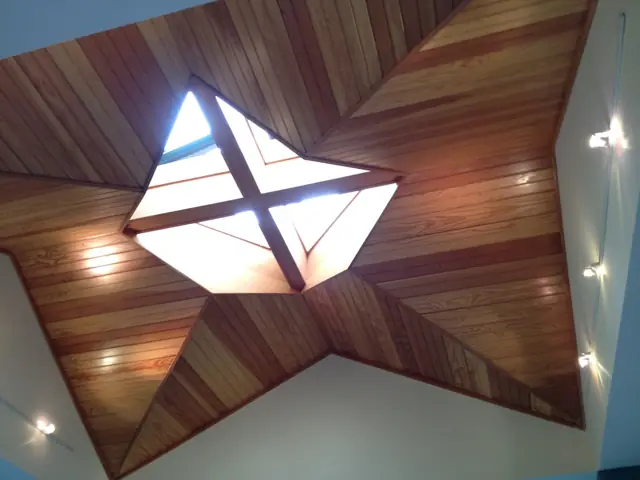 Star-shaped skylight set into a wood ceiling